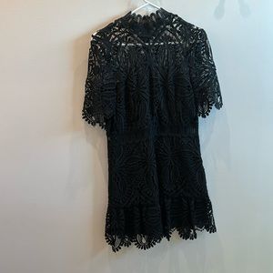 Black lace mini dress with see through mock neck